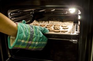 Cookies Being placed into a heated range oven